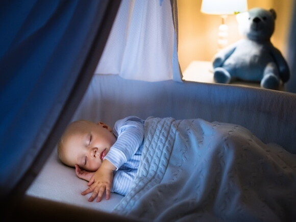 A child in the night enjoying of a good baby sleep