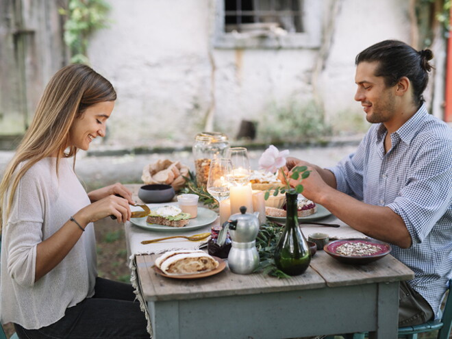 A couple eating breakfast with nutrition for fertility.