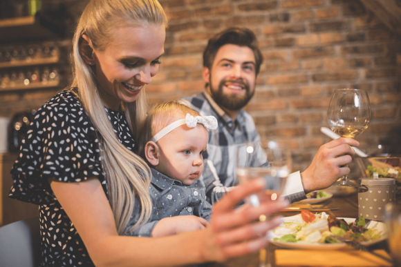 A family eating together in a restaurant.